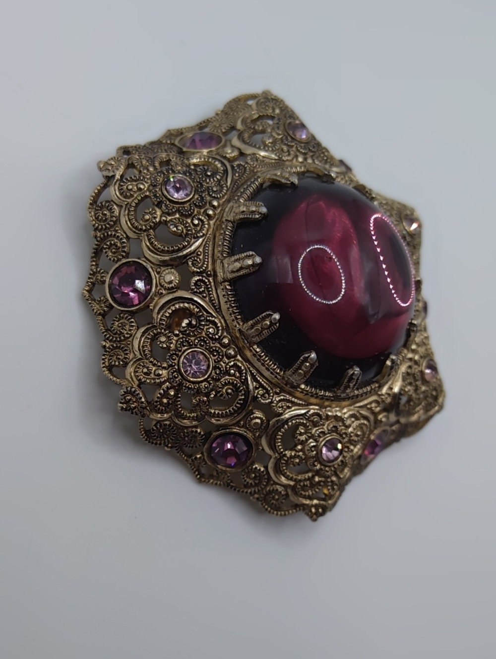Western Germany Filigree, Purple Glass Cabachon, and Purple Rhinestone Brooch - Picture 4 of 7